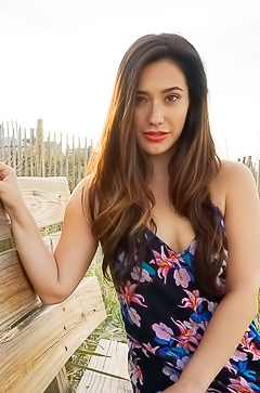 Cute teen posing in red lingerie on the beach