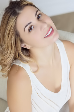 Alice Kelly Dark-eyed Siren Smiles Enticingly As The Straps Slide From Her Shoulders