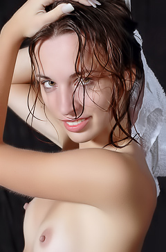 Natalia B Entices In A Nude Solo Pose With Wet Hair And A Towel In Studio Shadows