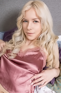 Lily H Stretches Nude on White Sheets by Bedroom Window